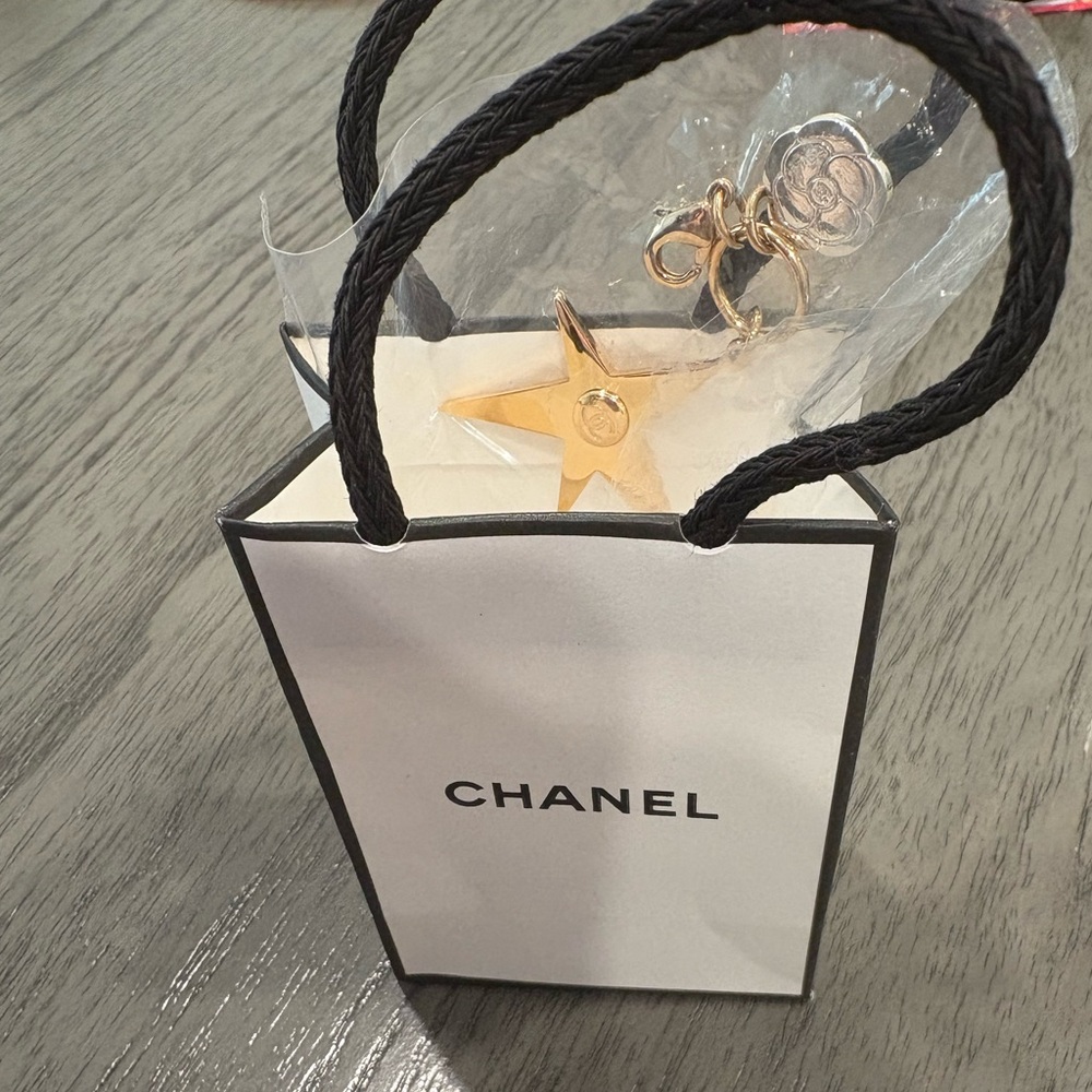 * CHANEL Gold Star Charm Keychain
